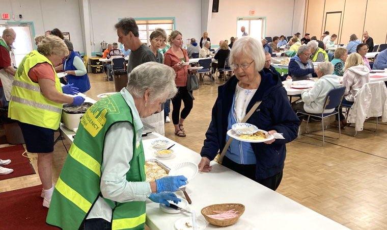 CERT team members serve breakfast to sold-out crowd on February 19.