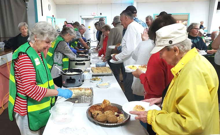 CERT team members serve breakfast to sold-out crowd.